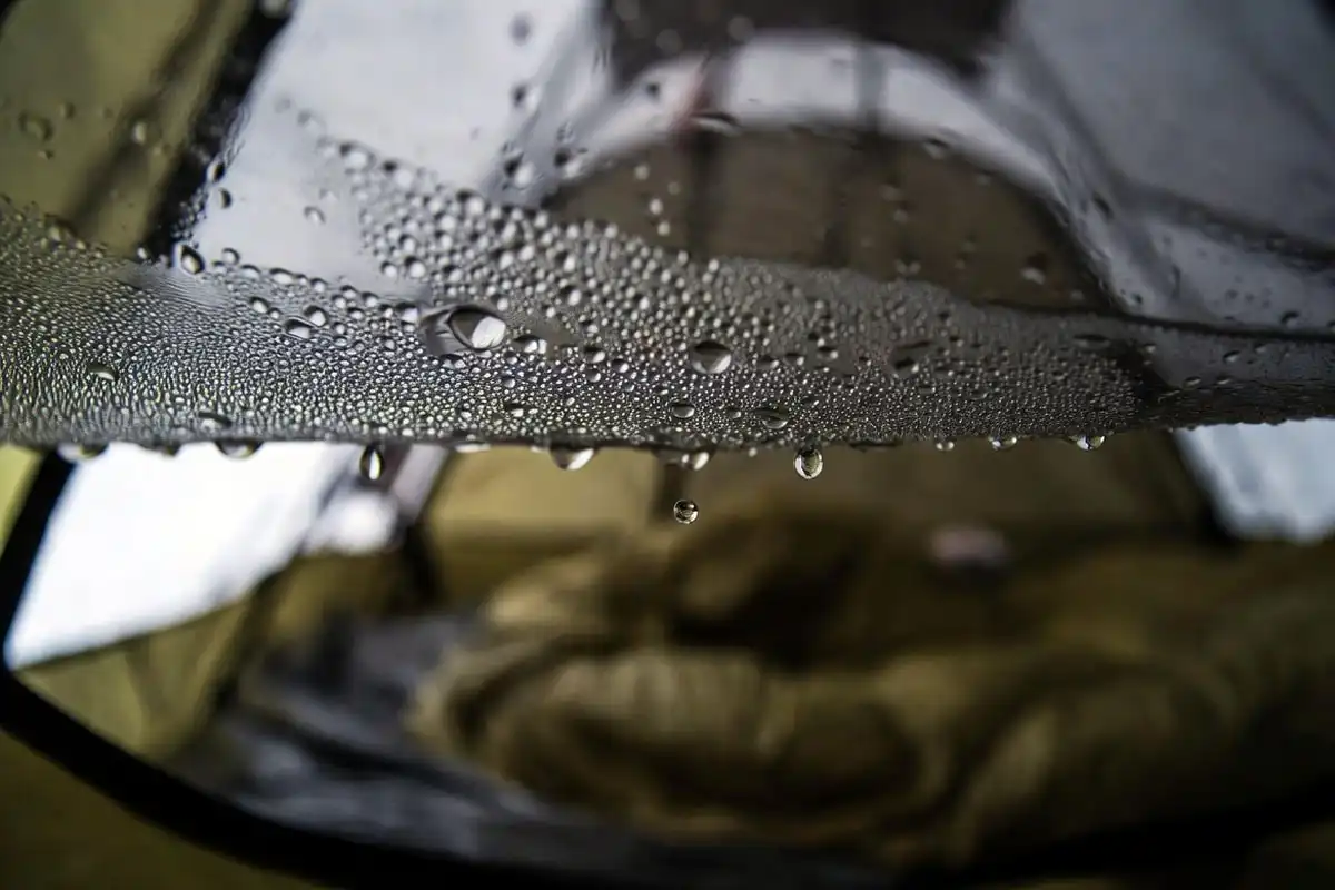 water droplets forming on the inside fabric of a sealed camping tent