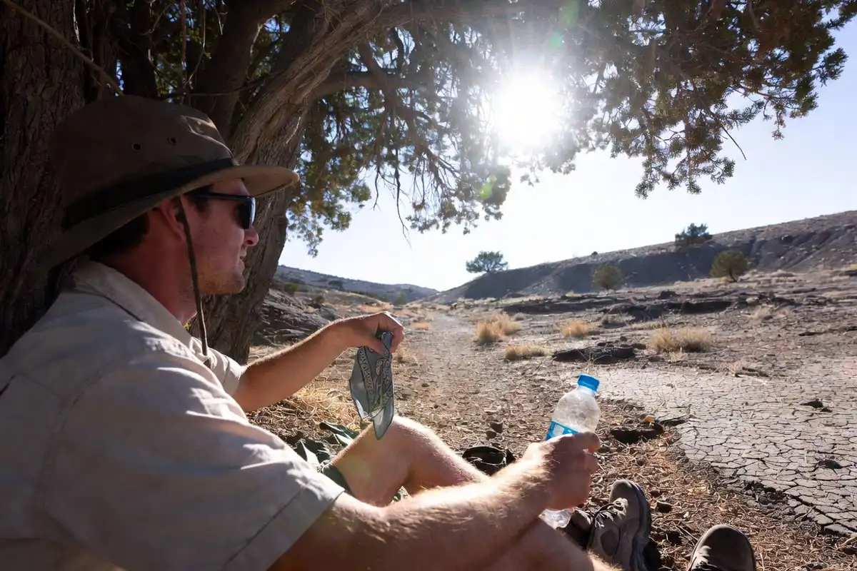 cooling with a wet bandana during a hot hike