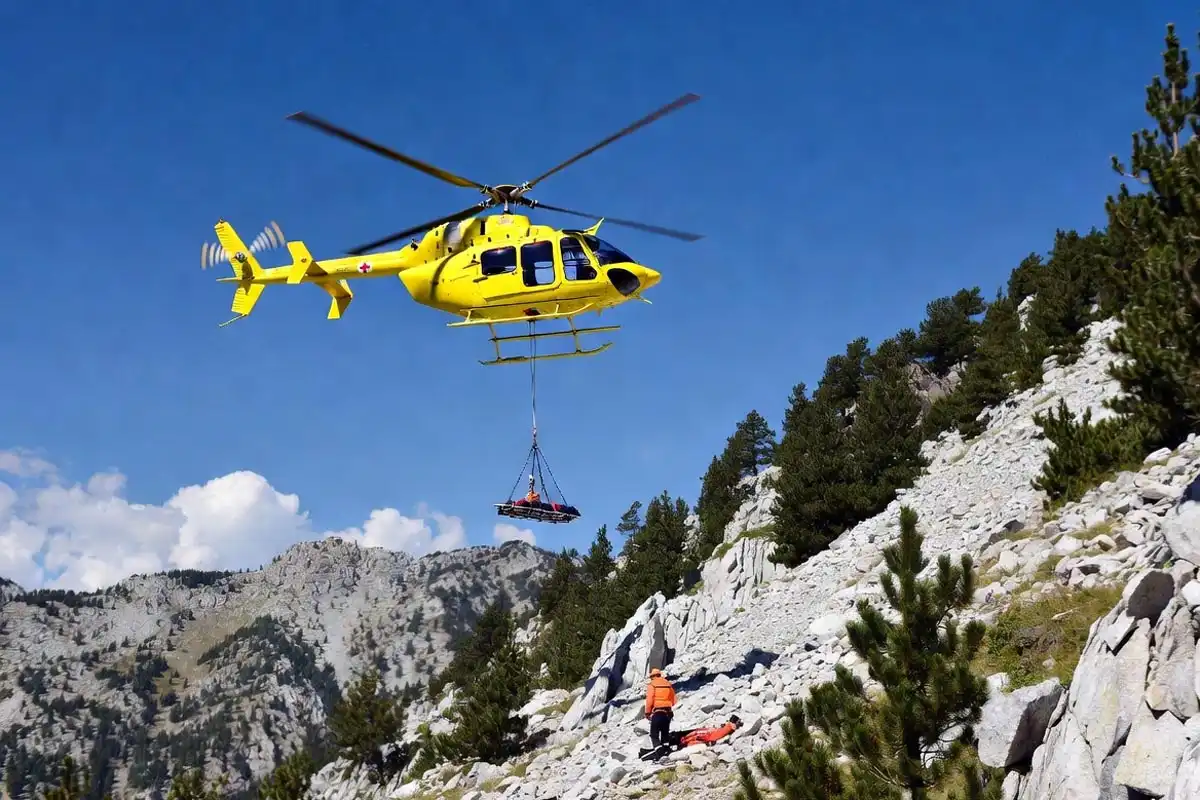 emergency helicopter evacuating injured hiker from rocky mountain terrain