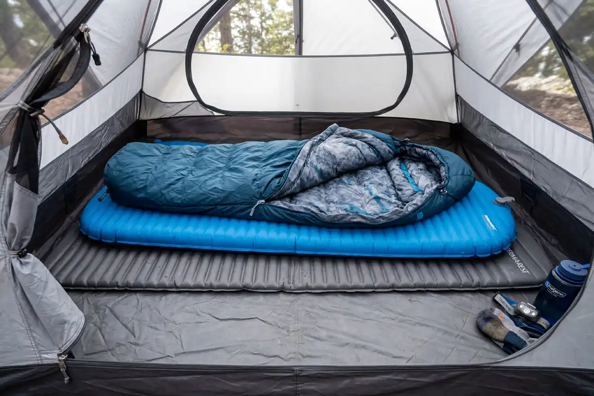 cell foam pad and inflatable sleeping pad layered inside tent for cold ground insulation