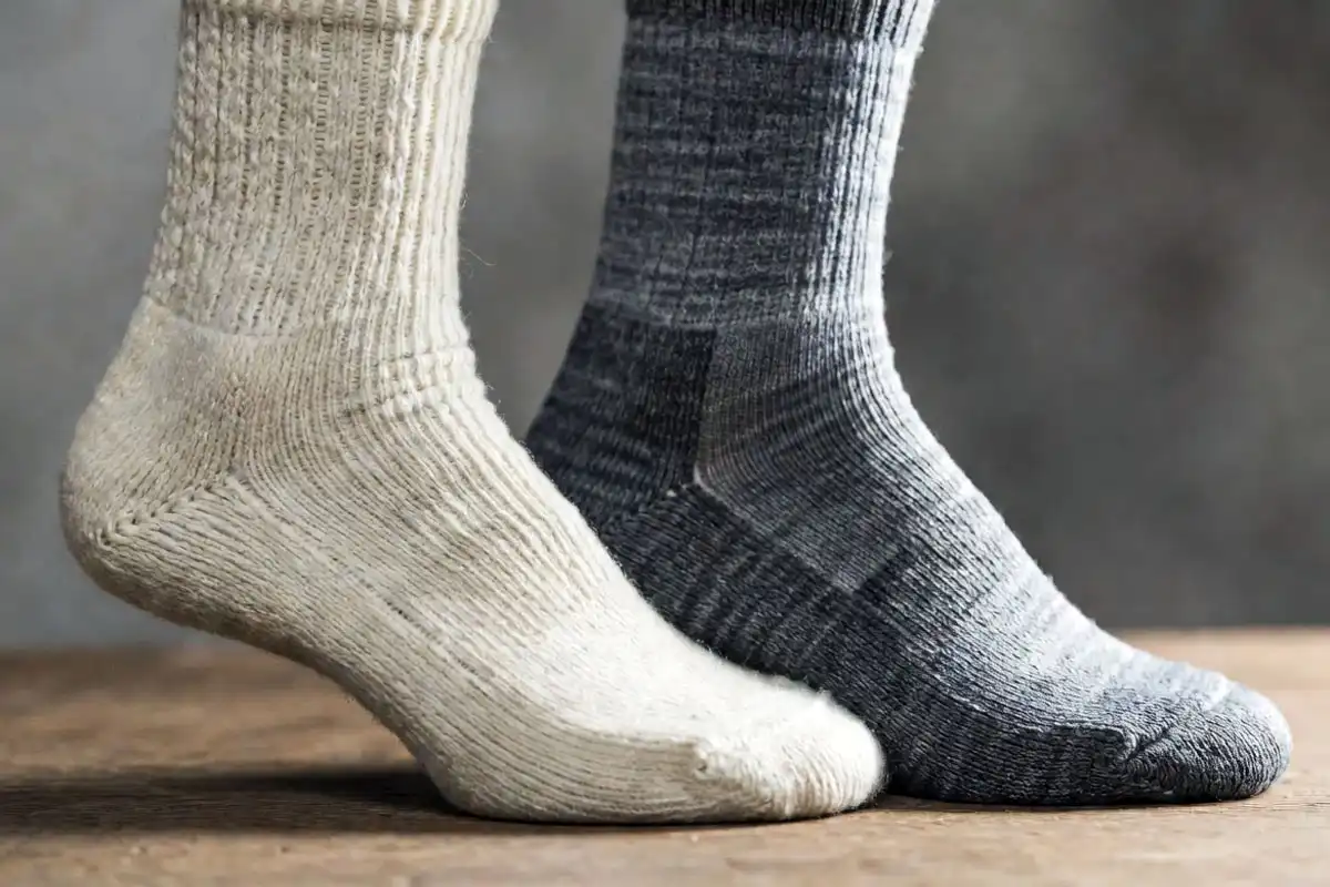 merino wool and synthetic hiking sock side by side texture comparison