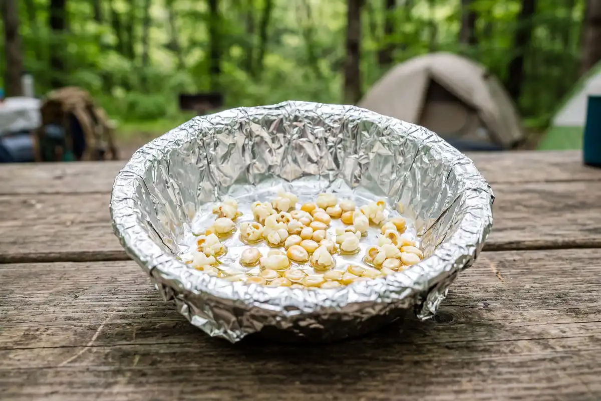 Tight foil packet with room for expansion ready for campfire cooking