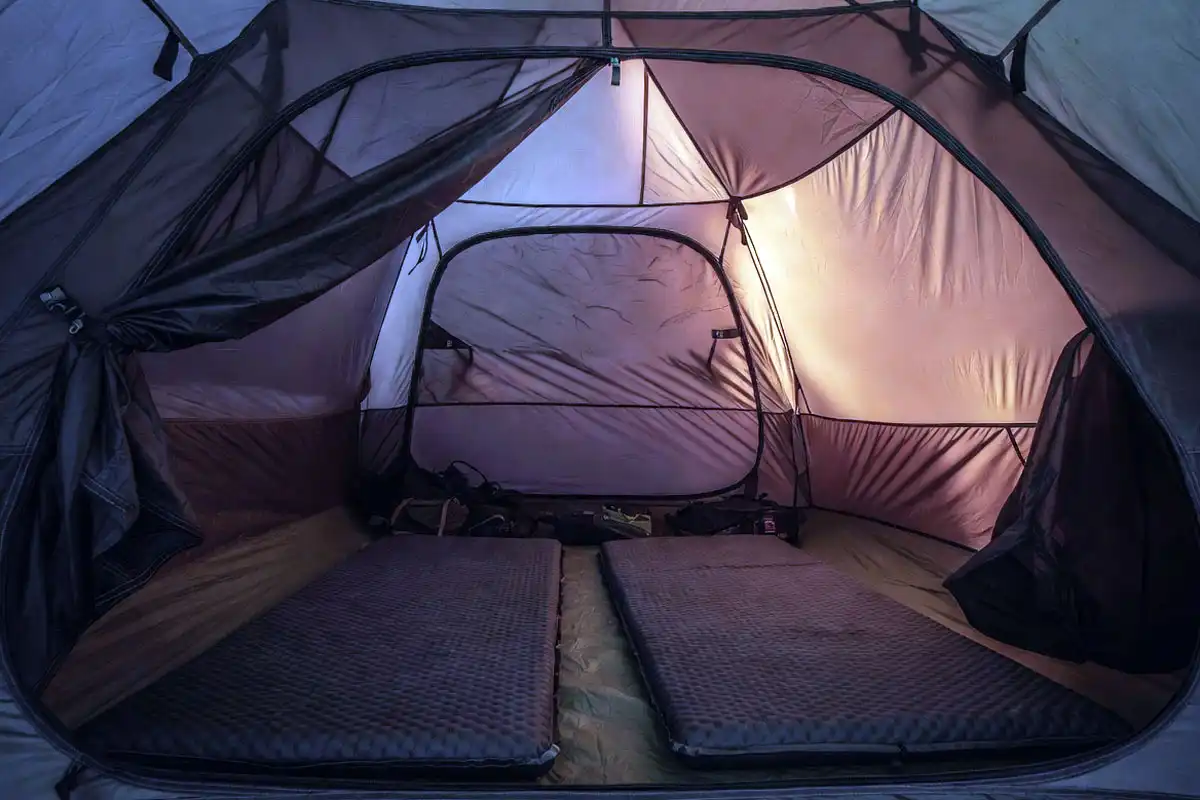 two sleeping pads laid side by side inside a two person tent interior