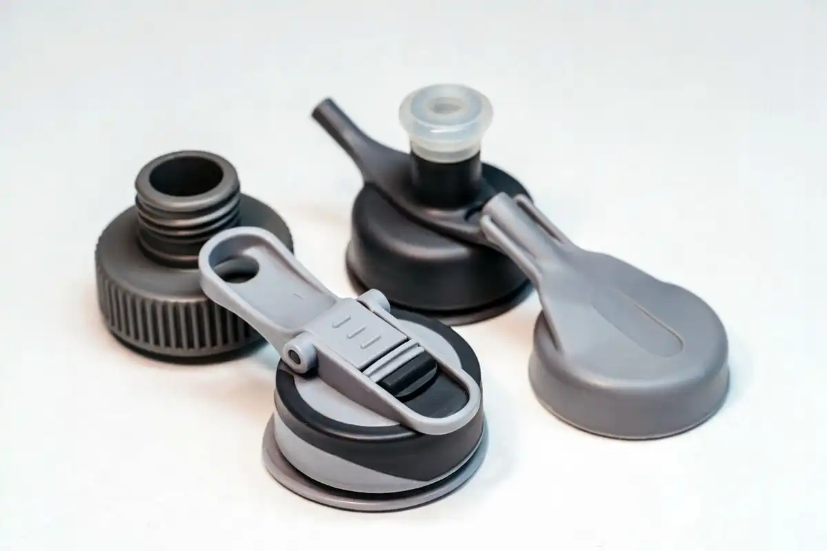 screw cap flip top lid and bite valve on collapsible travel bottles