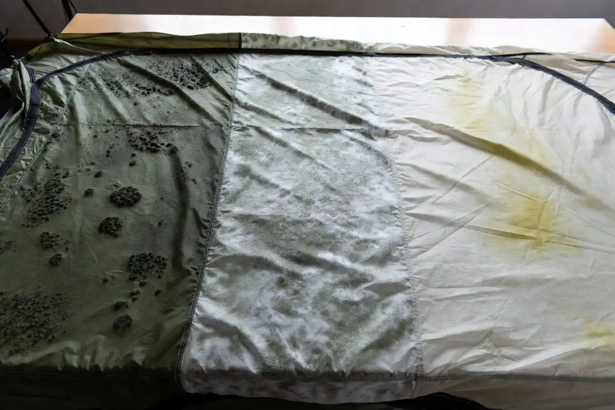 Side by side comparison of black mold white mildew and clean tent fabric