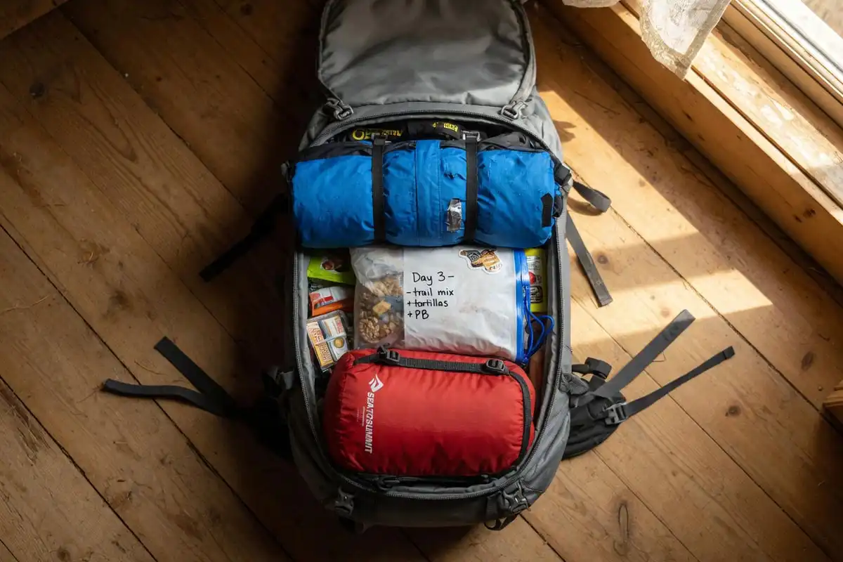 Cutaway view of a backpack with a compression sack resting at the base