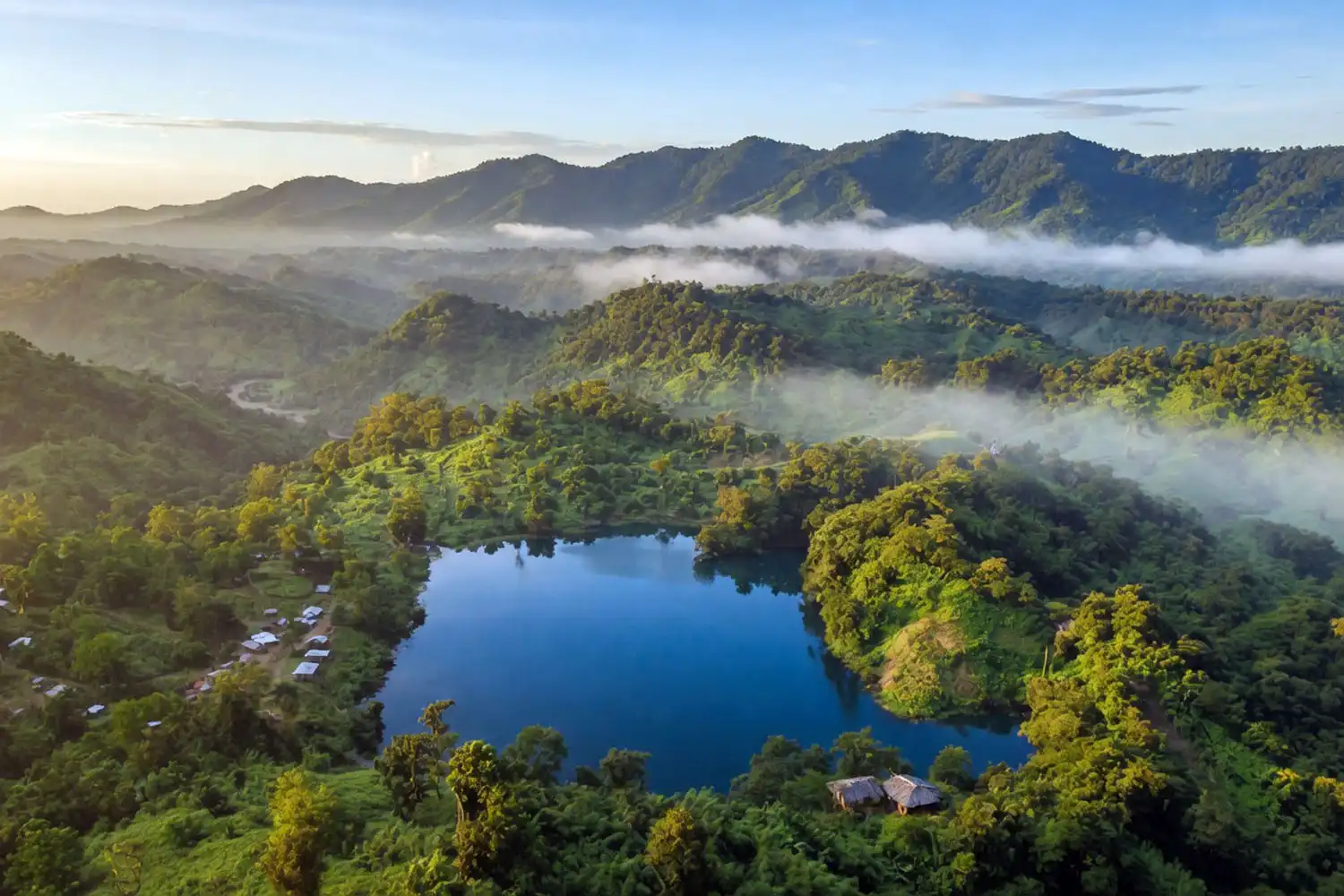 Aerial view of Boga lake, a blue natural lake ringed by forested hills in Bandarban, Bangladesh
