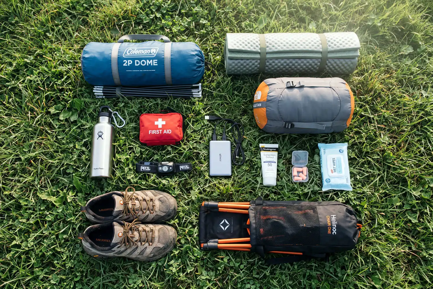 My Festival camping checklist including tent, sleeping bag, headlamp, water bottle, sunscreen, first-aid kit, and earplugs