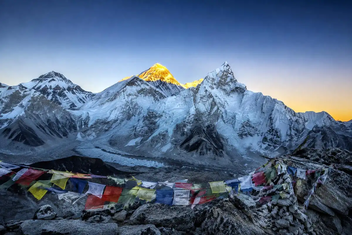 Golden sunrise light hitting the summit of Mount Everest seen from Kala Patthar viewpoint at 5,545 meters