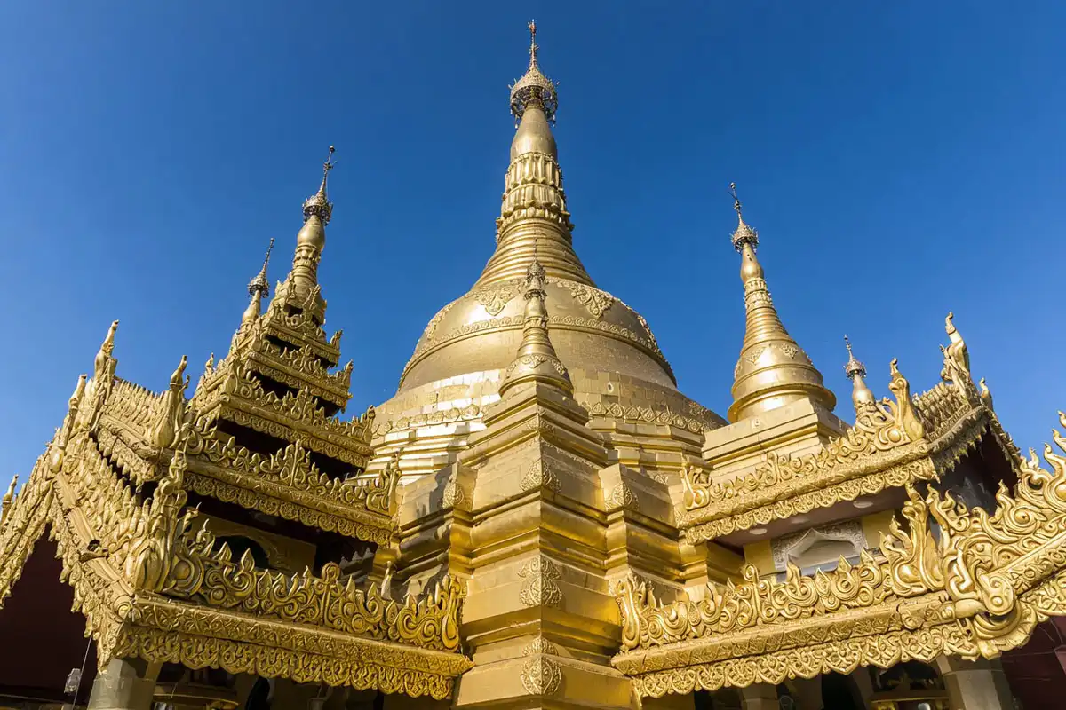 Close view of the golden tiles and ornate roof tiers of the Buddha Dhatu Jadi pagoda in Bandarban