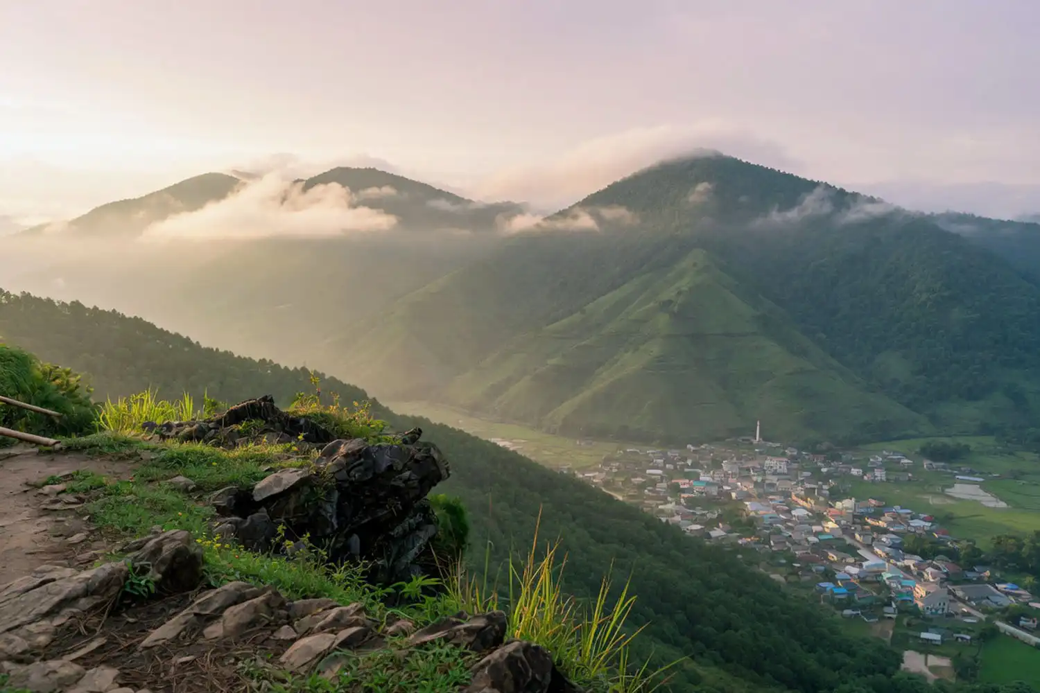 Early morning clouds drifting over the Nilachal hilltop with Bandarban town visible below in the Chittagong Hill Tracts