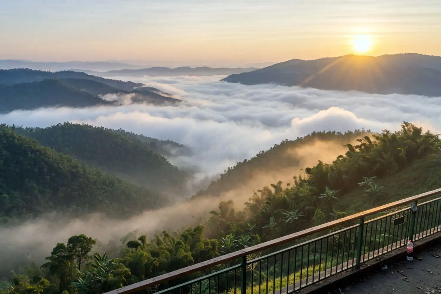 Sea of clouds rolling over green hills at sunrise from the Nilgiri summit in Bandarban Bangladesh